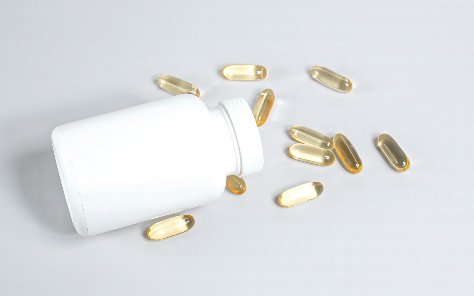 Is Plant Based Omega 3 as Good as Fish Oil | Calmly Rooted Bottle of pills spilling out