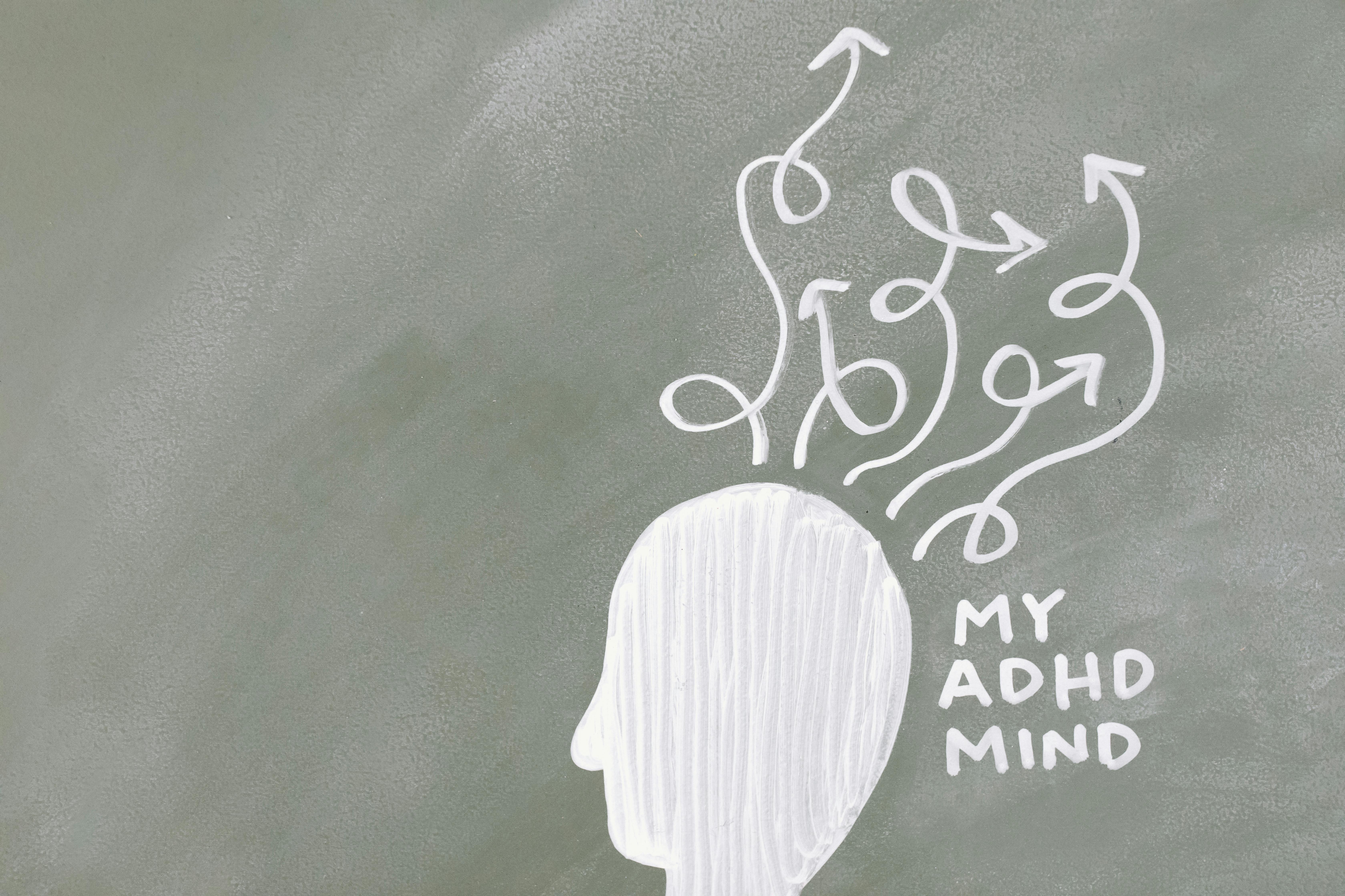 Tired but Wired? Why You Can’t Sleep & How to Fix It | Calmly Rooted Chalk-style illustration of a head with chaotic, tangled arrows representing a restless, racing mind and the feeling of being tired but wired.
