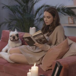 melamed-cbd-alcohol-alternative-anxiety-west-bloomfield.jpg | Calmly Rooted A woman in West Bloomfield MI practicing a 5-minute evening tea ritual on a sofa with MelaMed CBD as part of her sustainable, plant-based relaxation routine for anxiety.