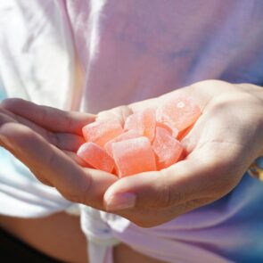 A person holding gummies